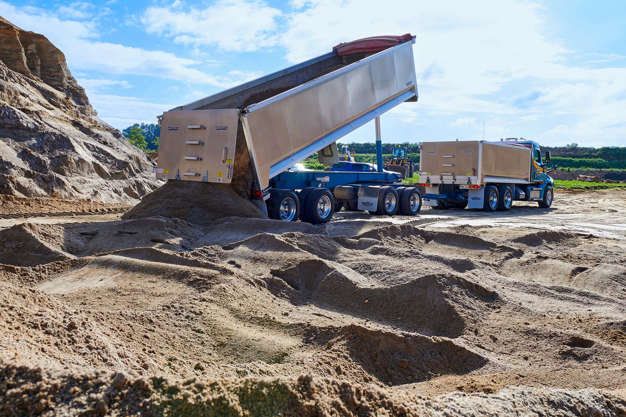 Freightliner Cascadia tipping out a load of sand