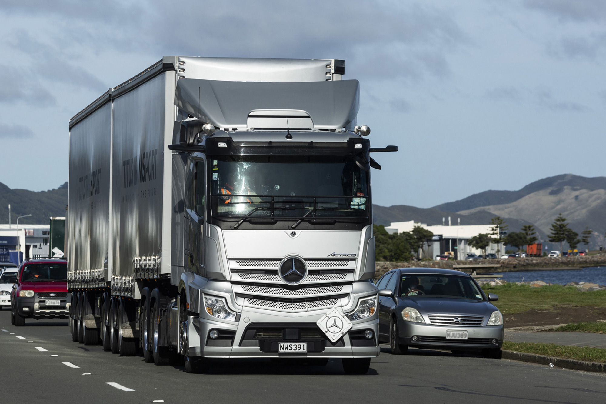 The Mercedes-Benz 6x4 Actros looks imposing on the road. 