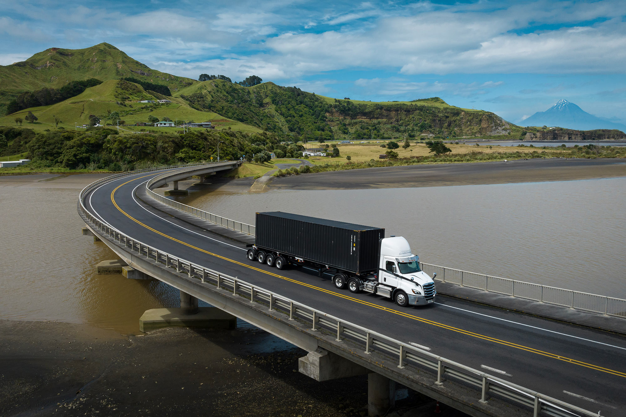 A Freightliner Cascadia crossing a bridge