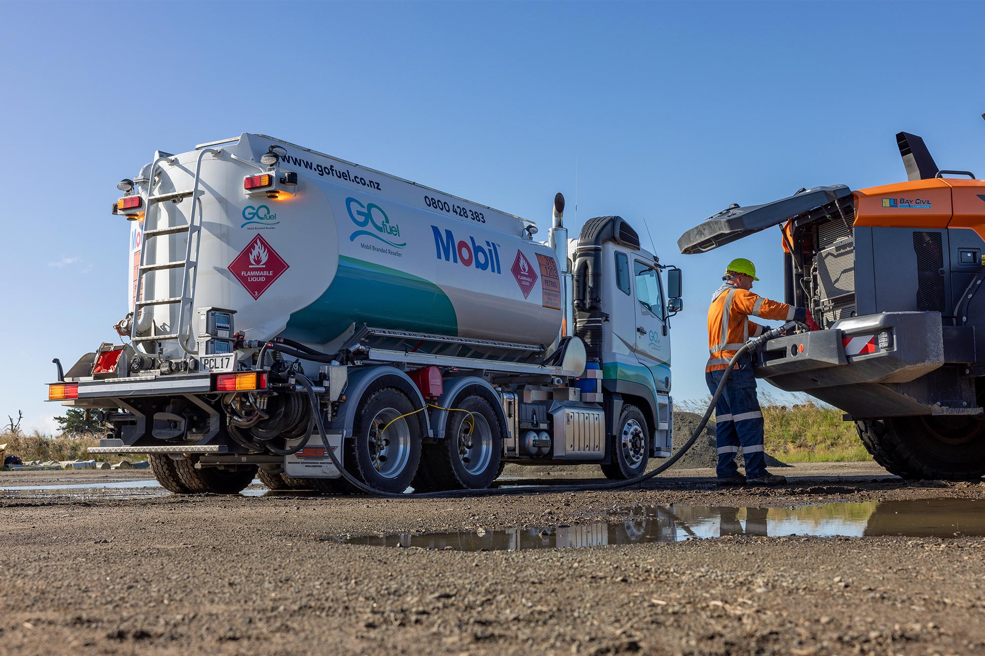 A FUSO Shogun 460hp heavy-duty truck refilling construction equipment