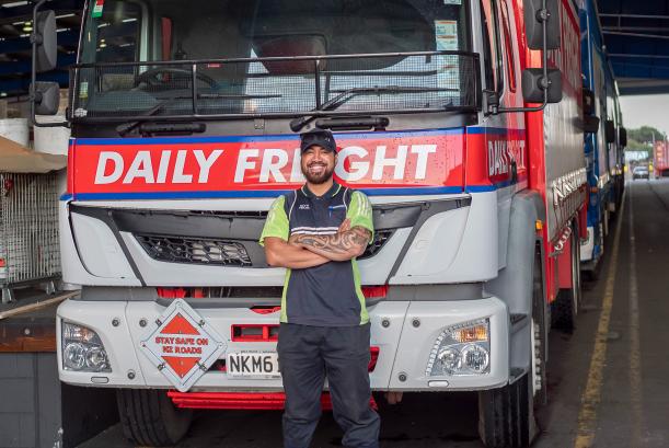 Johaly Partnership’s driver Devyn Pekamu stands by his medium-duty Enduro curtainsider 