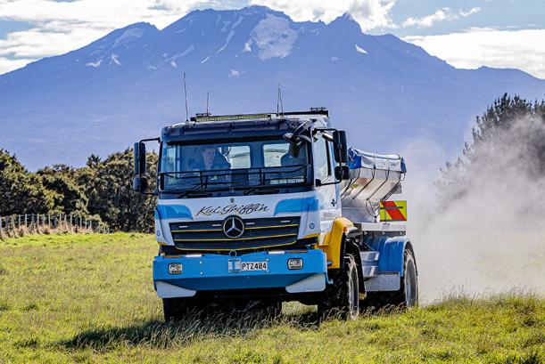 A Mercedes-Benz Atego at work in a field 